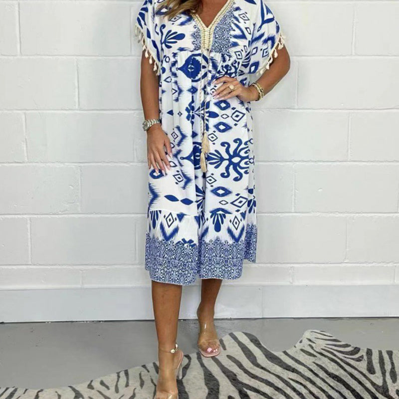 ⏰ Endast nu 49% rabatt!🔥Elegant och chic klänning med tryckt V-ringning och tasselutsmyckning