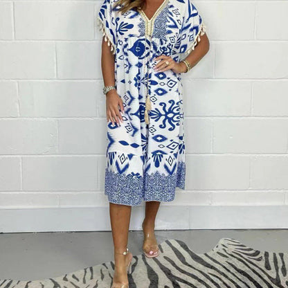 ⏰ Endast nu 49% rabatt!🔥Elegant och chic klänning med tryckt V-ringning och tasselutsmyckning