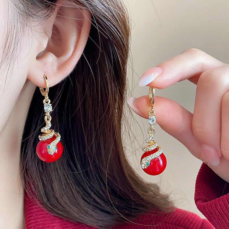 🐍Nyårsrea🎀Förgyllda örhängen med ormpärla