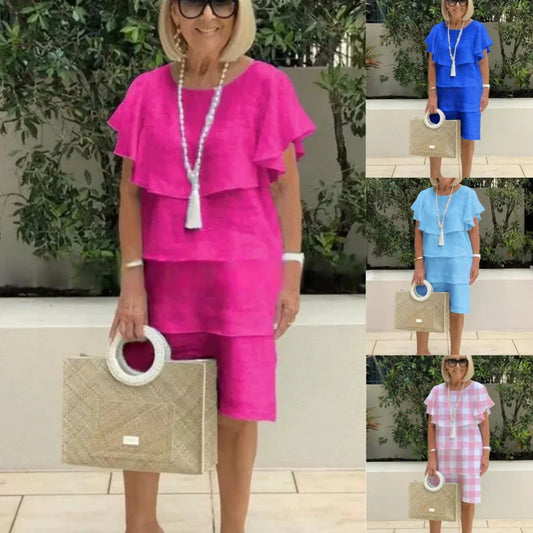 Kortärmad knälång chiffongklänning med volangdetaljer