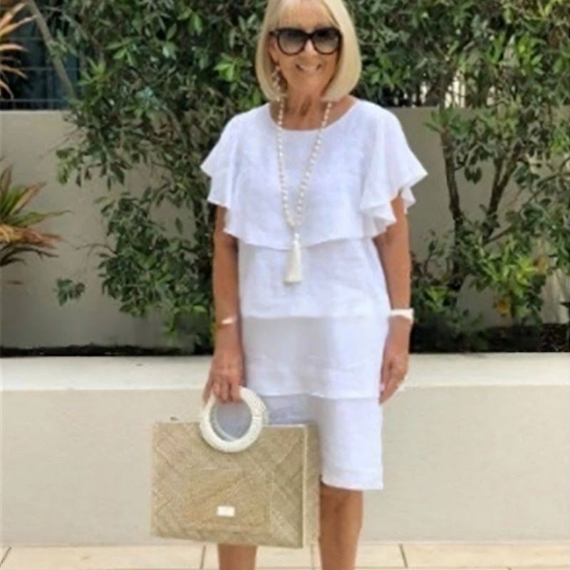 Kortärmad knälång chiffongklänning med volangdetaljer