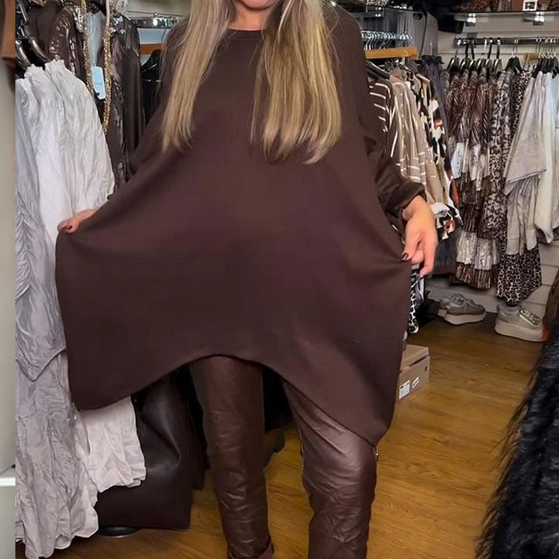 Oregelbunden lös överdel och enfärgade byxor, tvådelat set