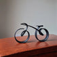 ( 🔥 VARM REA NU 49% OFF) - Minimalistisk cykel skulptur tråd inramad stil